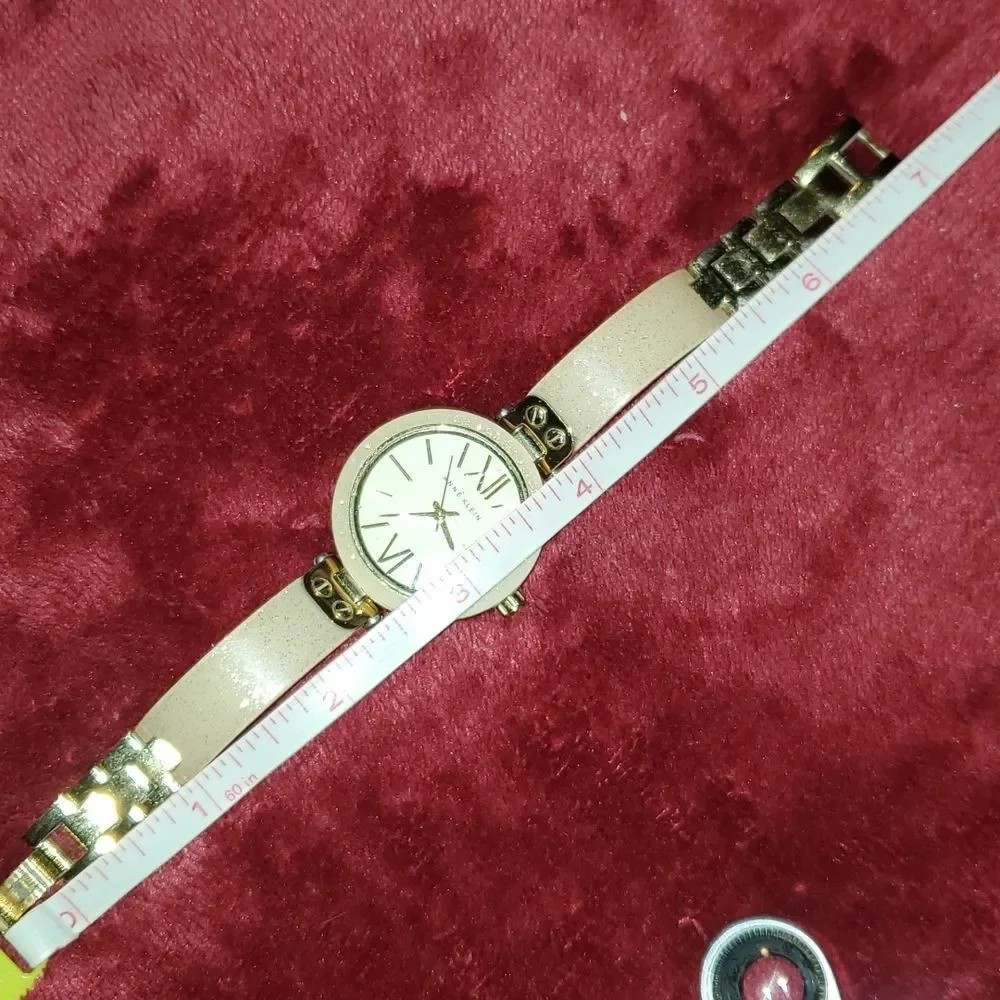 Anne Klein Women's AK-1408CRCR‎ Gold Plastic Analog Quartz Bangle Style Watch